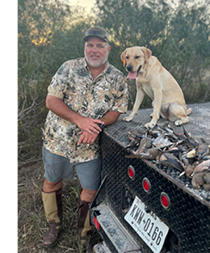 Daniel Greak and yellow lab