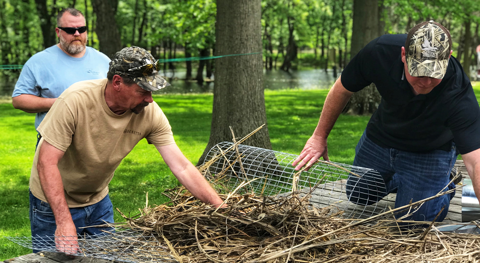 volunteers putting together hen house